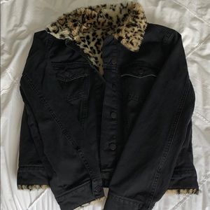 Black jean jacket with leopard fur inside